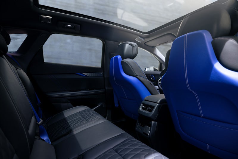 Back Seat View of the 2026 OPTIQ-V Blue Front Seats, Sun Roof, and Interior | Prestige Cadillac in WARREN MI