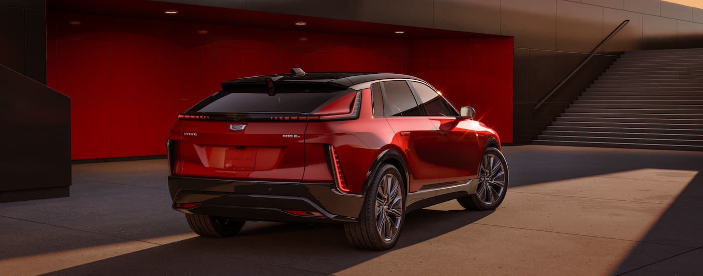 A red 2025 Cadillac LYRIQ for sale near Sterling Heights from the rear.