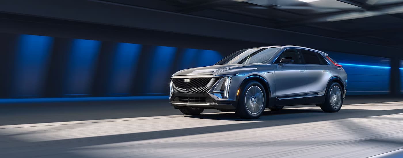 Silver 2026 Cadillac LYRIQ-V driving through a tunnel.