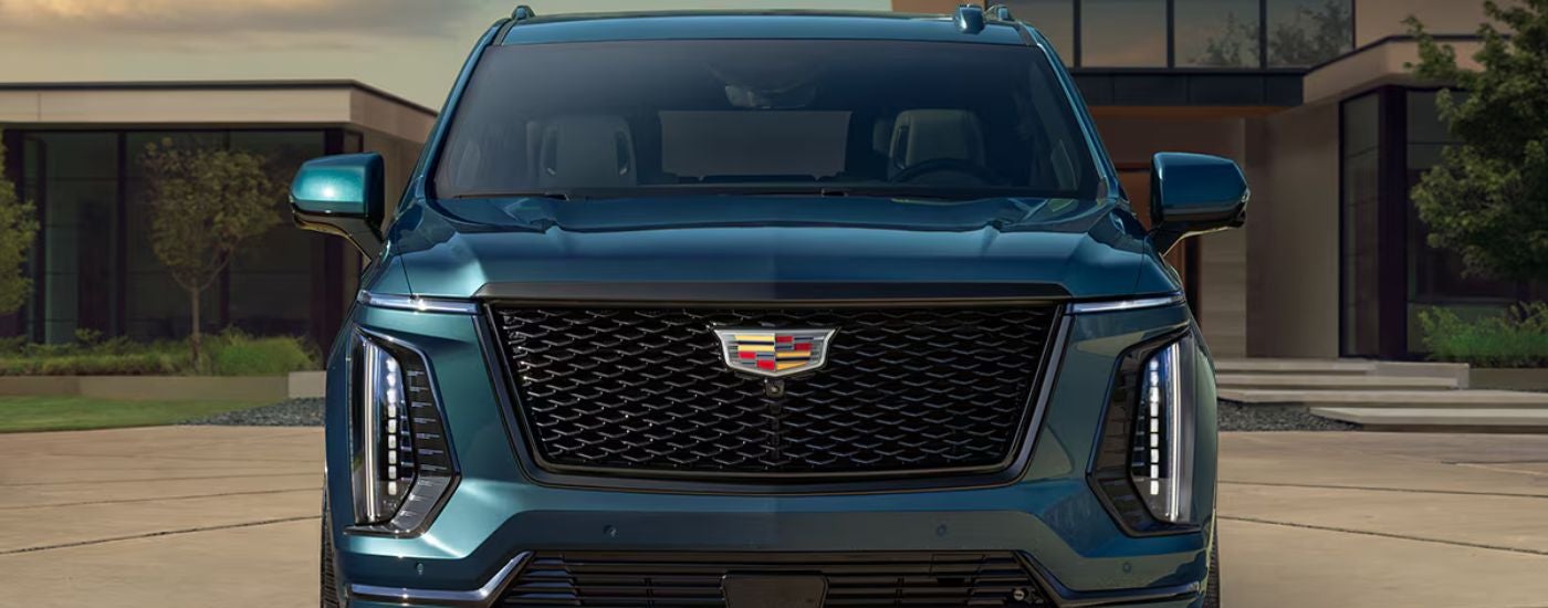 Blue 2026 Cadillac Escalade front view close up.