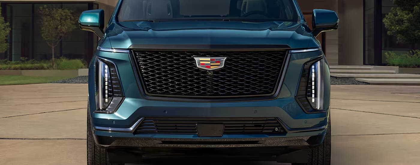 Blue 2026 Cadillac Escalade parked in a driveway