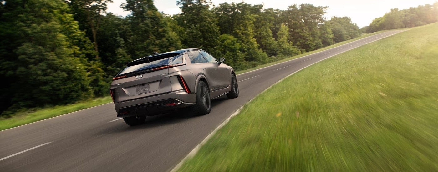 A grey 2026 Cadillac LYRIQ-V for sale near Sterling Heights from the rear at an angle.