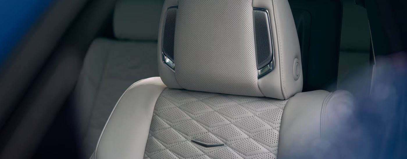 The white leather front seat with built in speakers on a 2026 Cadillac Escalade.