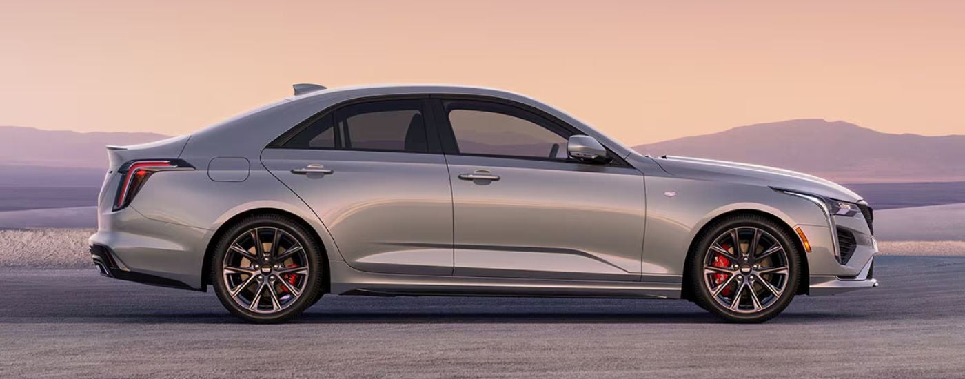Silver 2026 Cadillac CT4 at sunset.