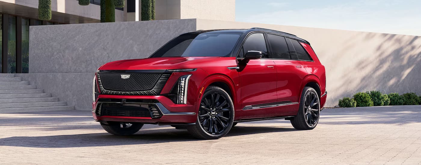 Red 2026 Cadillac VISTIQ parked on a driveway.