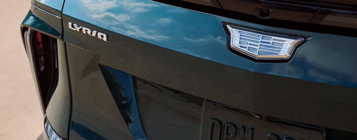 A close up of the rear badge on a blue 2025 Cadillac LYRIQ for sale.