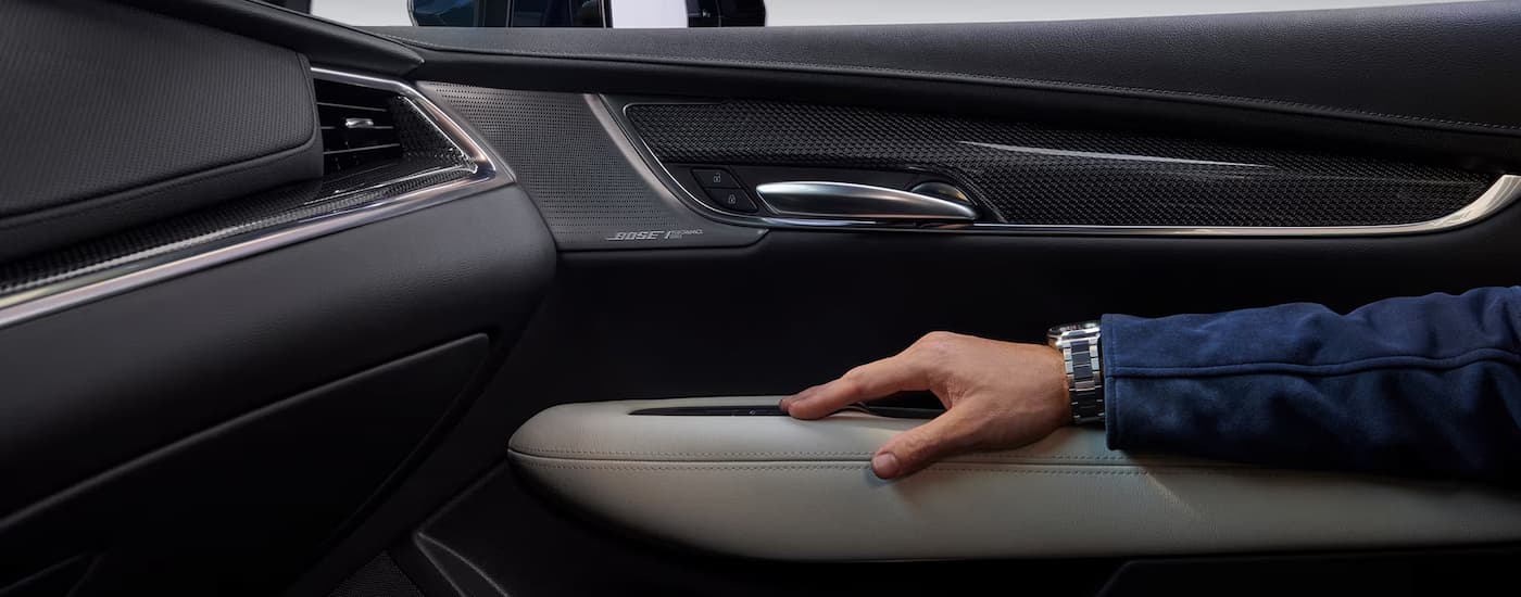 An arm on the door of a 2025 Cadillac XT5.