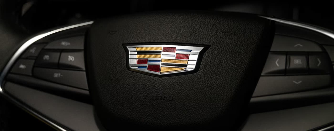 Close-up of the steering wheel in a 2025 Cadillac XT5 for sale near Utica.