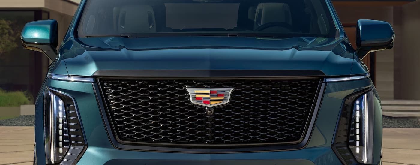 The front grille on a blue 2026 Cadillac Escalade from a dealer near Utica